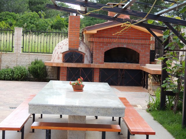 Barbecue and traditional wood-fired brick oven
